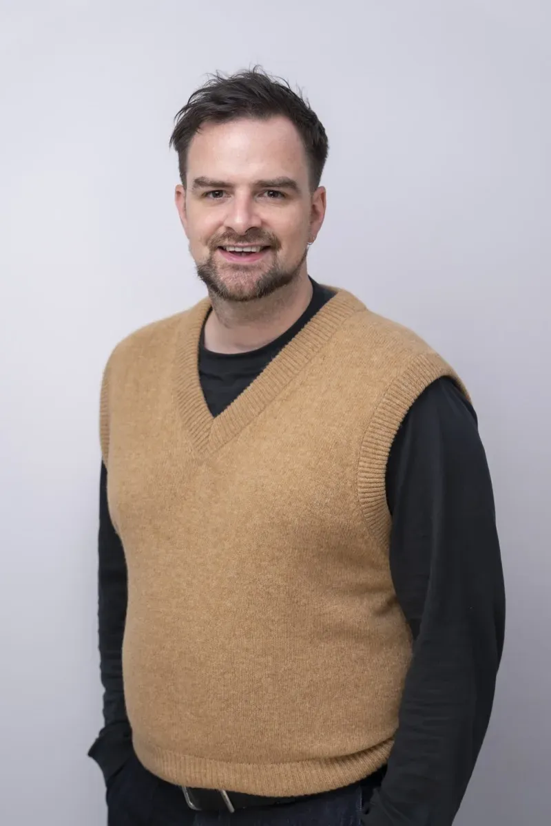 Greg Quee as a friendly brick figure